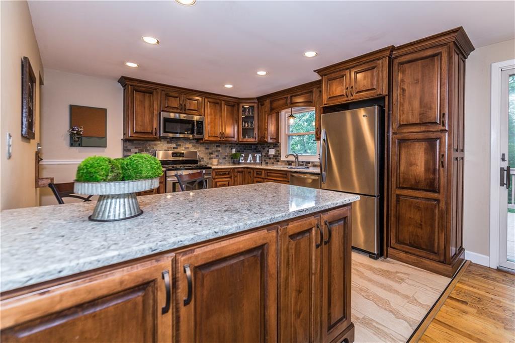 205 Wyngate Road Coraopolis, PA 15108 - Photo 3 of 25 Enjoy morning coffee as the breakfast bar, kitchen features loads of storage with pull out shelves, built in appliances and neutral decor.