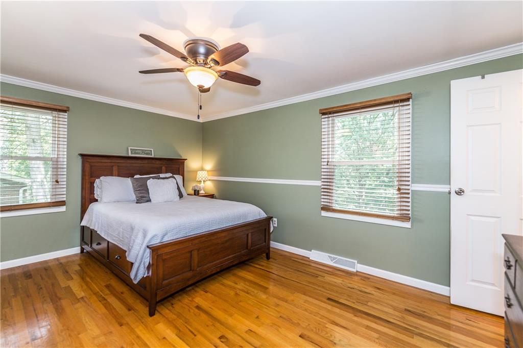 205 Wyngate Road Coraopolis, PA 15108 - Photo 10 of 25 Spacious master bedroom features hardwood floors, crown molding and overhead light and ceiling for your comfort.