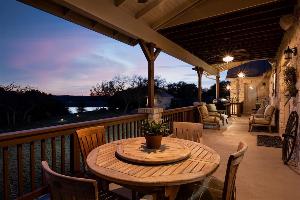 5255 Lookout Ridge Drive Marble Falls, TX 78654 - Photo 5 of 40 Large back covered patio at twilight with Lake view