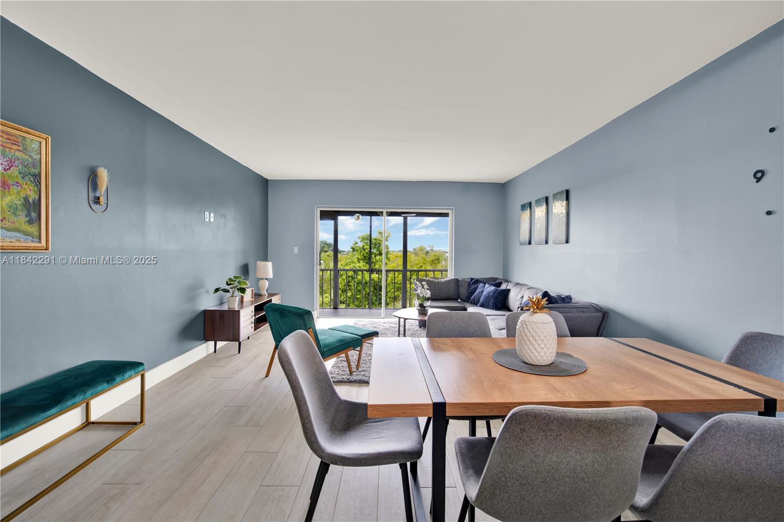a dining room with furniture a window and outside view