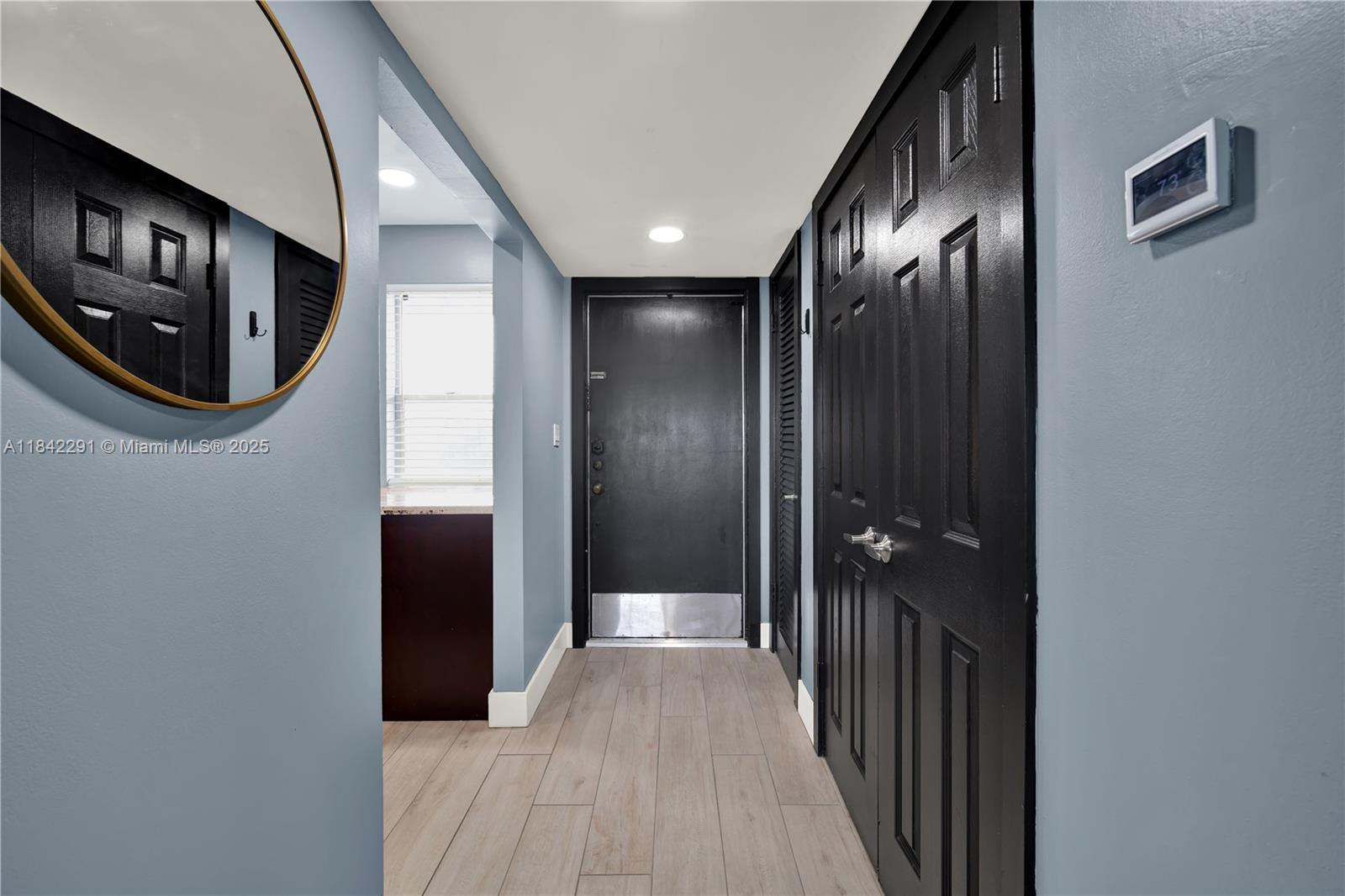 950 Hillcrest Drive, Unit 414 Hollywood, FL 33021 - Photo 14 of 35 a view of a hallway with wooden floor