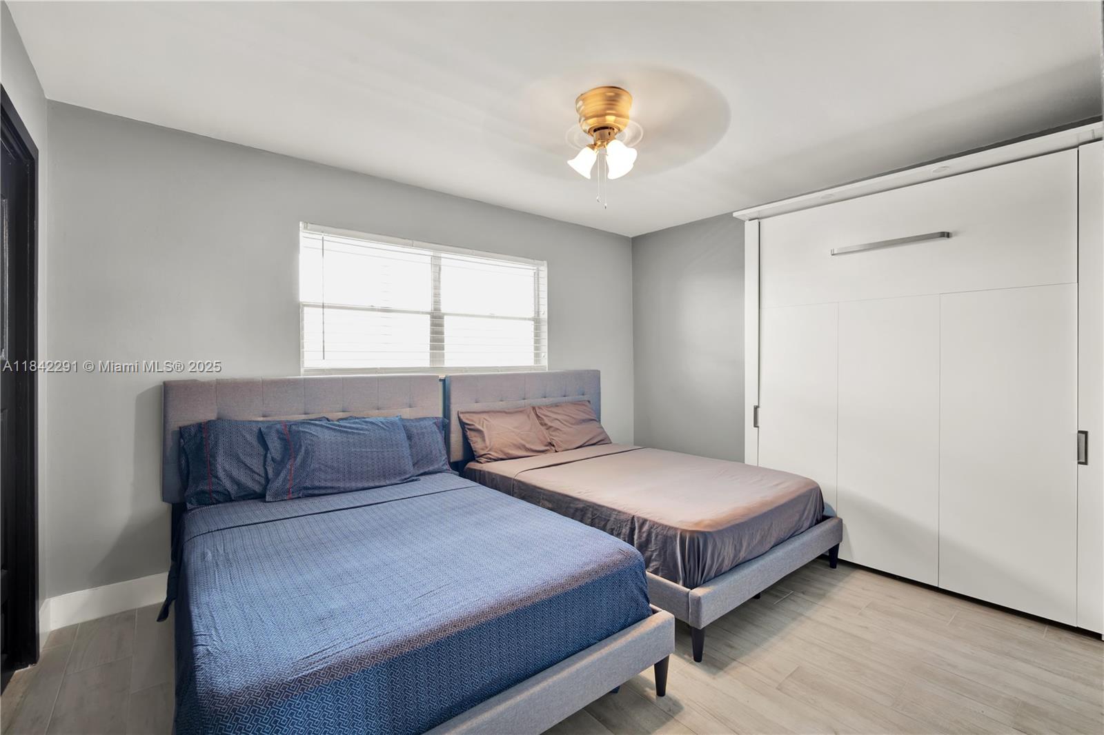 950 Hillcrest Drive, Unit 414 Hollywood, FL 33021 - Photo 21 of 35 a bedroom with a bed and window