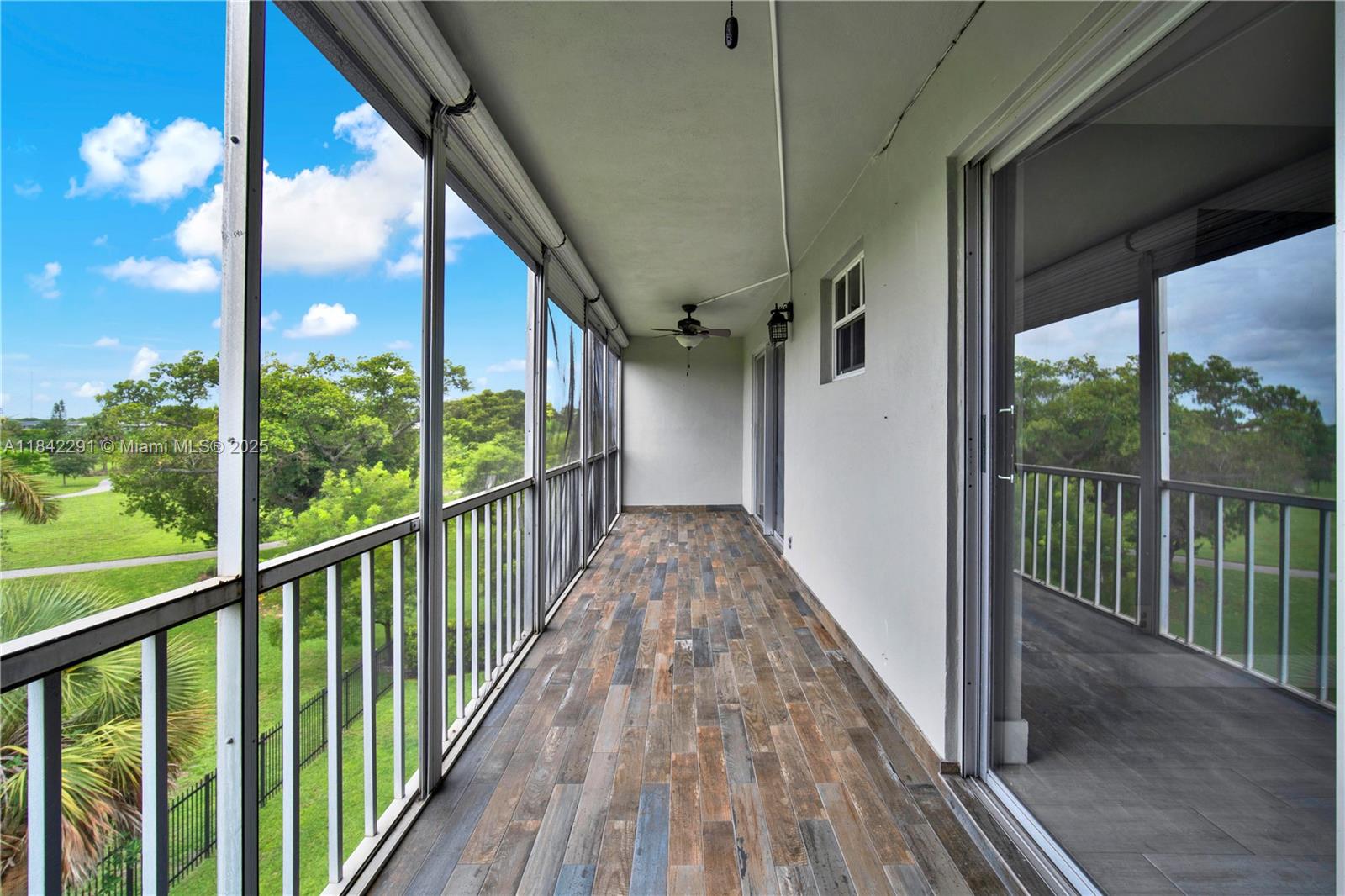 950 Hillcrest Drive, Unit 414 Hollywood, FL 33021 - Photo 28 of 35 a view of a balcony with wooden floor