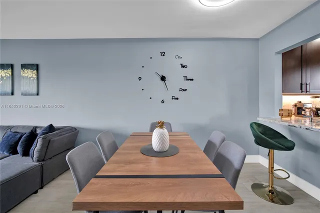 a room with furniture and a potted plant