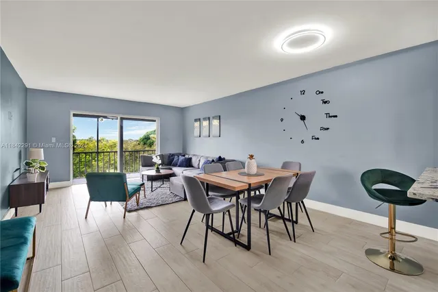 a view of a dining room with furniture window and outside view