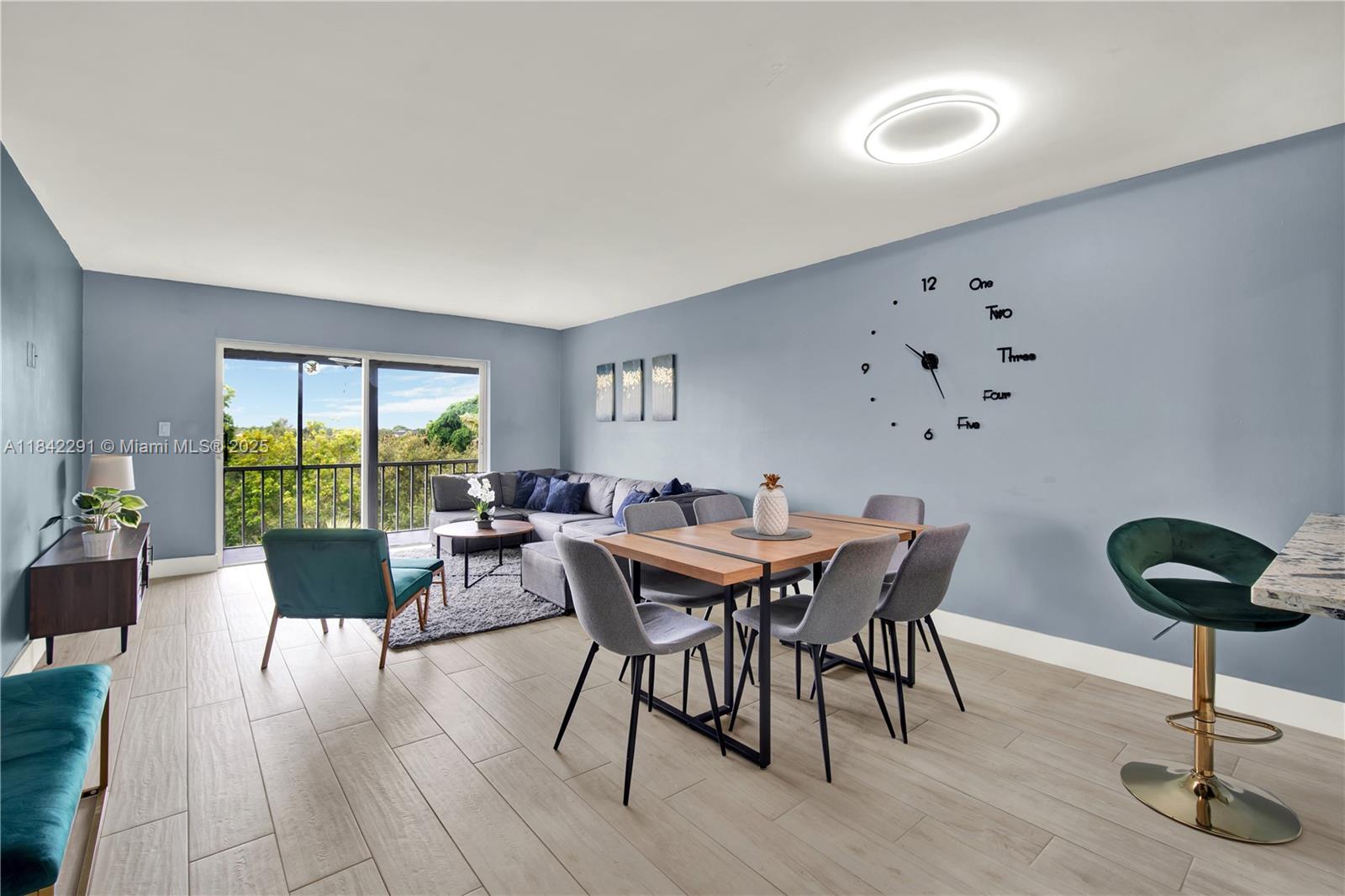 950 Hillcrest Drive, Unit 414 Hollywood, FL 33021 - Photo 4 of 35 a view of a dining room with furniture window and outside view