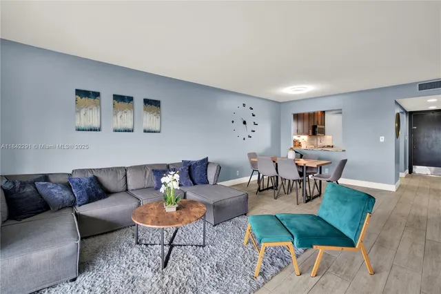 a living room with furniture and a rug