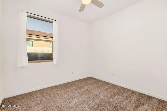 an empty room with closet area