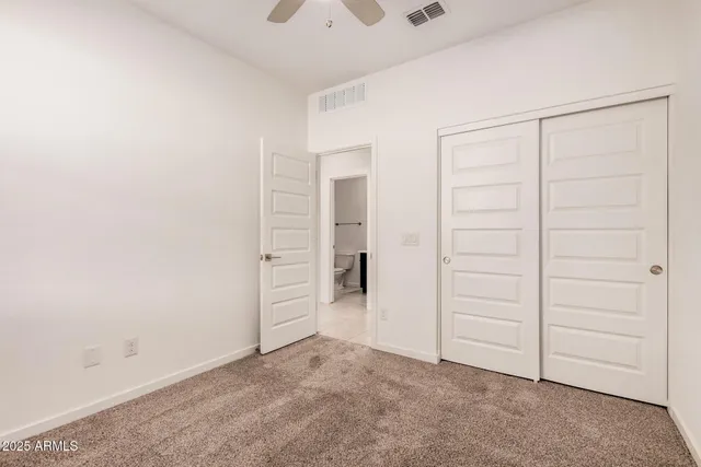 a bathroom with a sink toilet vanity and shower