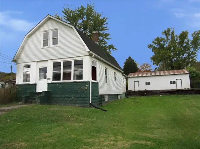a view of room with window and front door