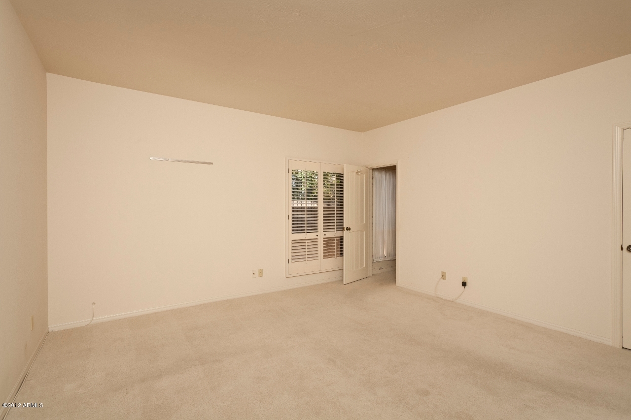 4444 East Camelback Road, Unit 22 Phoenix, AZ 85018 - Photo 16 of 26 a view of an empty room with a window