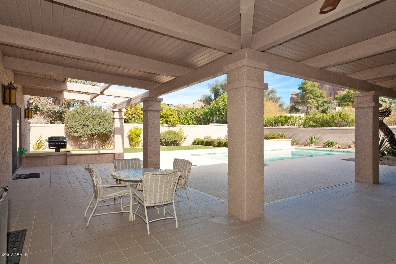 4444 East Camelback Road, Unit 22 Phoenix, AZ 85018 - Photo 21 of 26 a view of a patio with chairs and floor to ceiling window