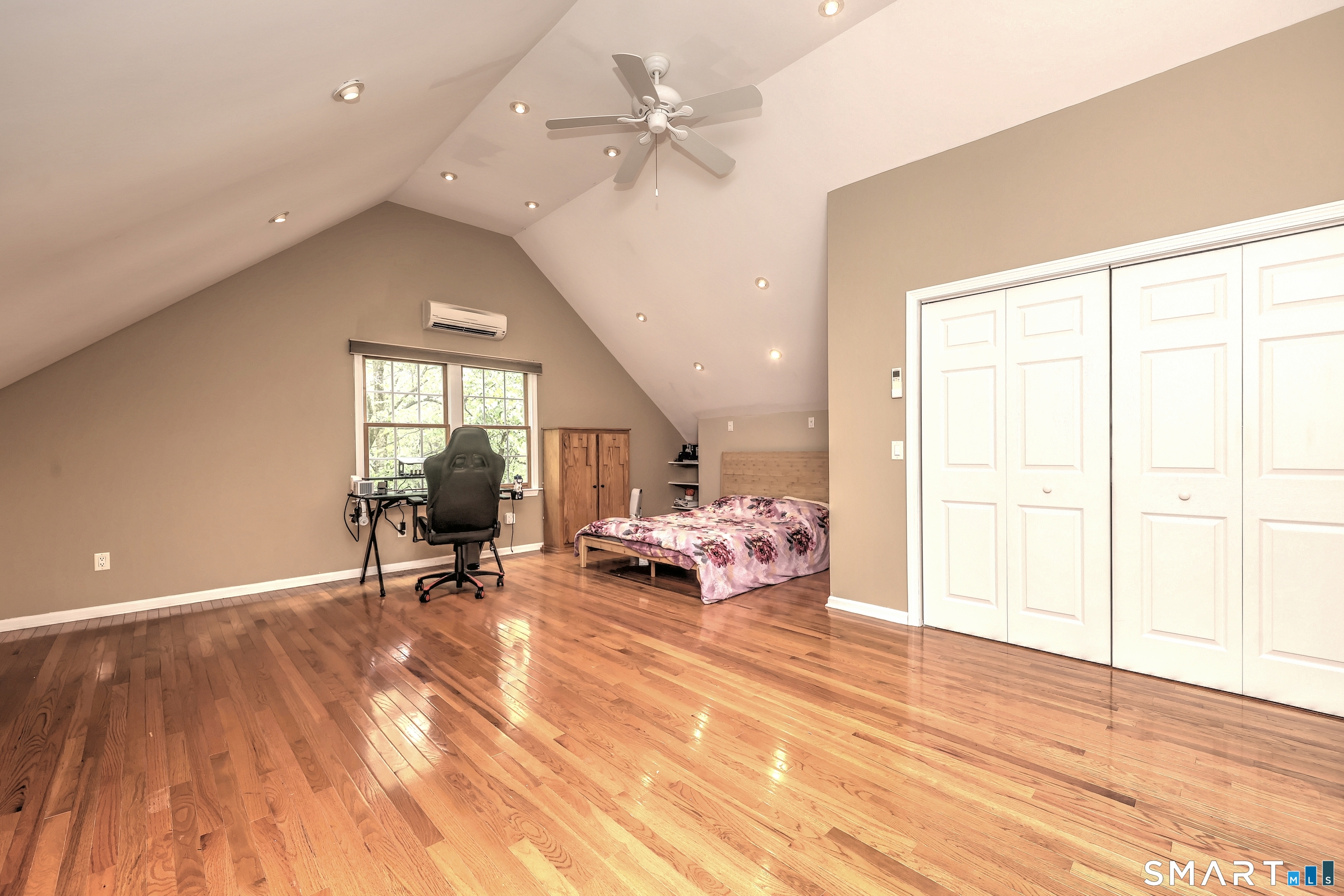 125 Peck Hill Road Woodbridge, CT 06525 - Photo 31 of 40 a view of a livingroom with furniture a ceiling fan and window