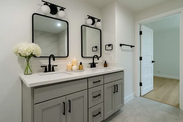 a bathroom with a double vanity sink and a mirror