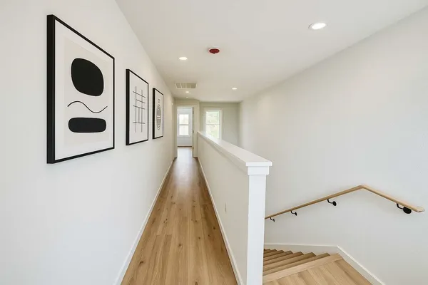 a view of a hallway with washer and dryer