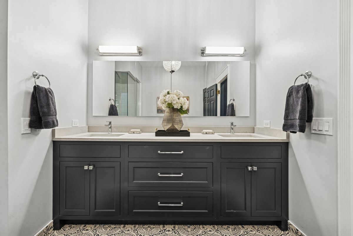 2661 North Dayton Street Chicago, IL 60614 - Photo 18 of 41 a bathroom with a double vanity sink and a mirror