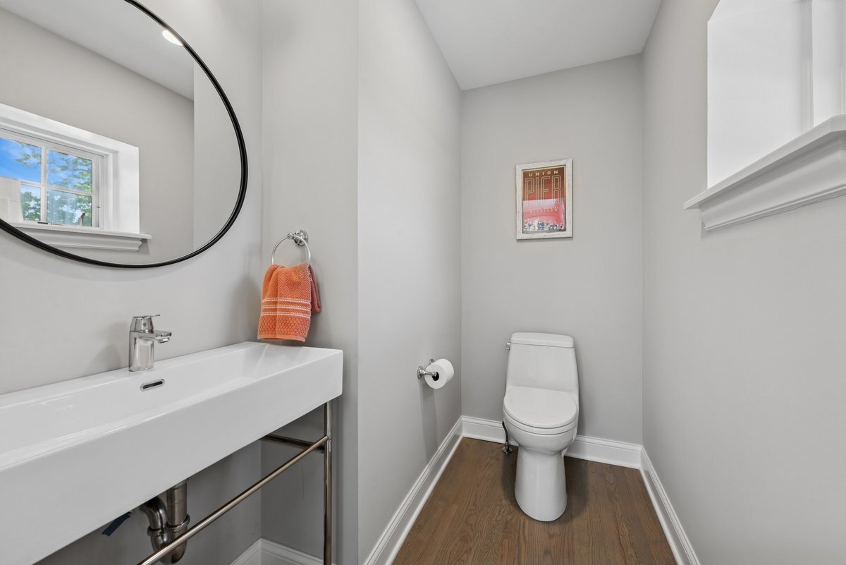 2661 North Dayton Street Chicago, IL 60614 - Photo 27 of 41 a bathroom with a toilet a sink and mirror