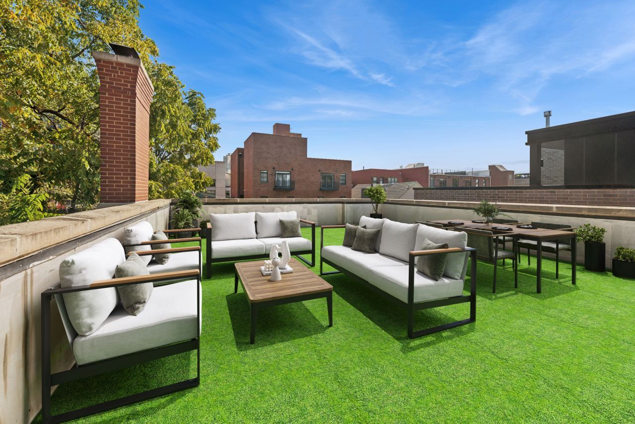 2661 North Dayton Street Chicago, IL 60614 - Photo 28 of 41 a roof deck with couches and potted plants with sky view