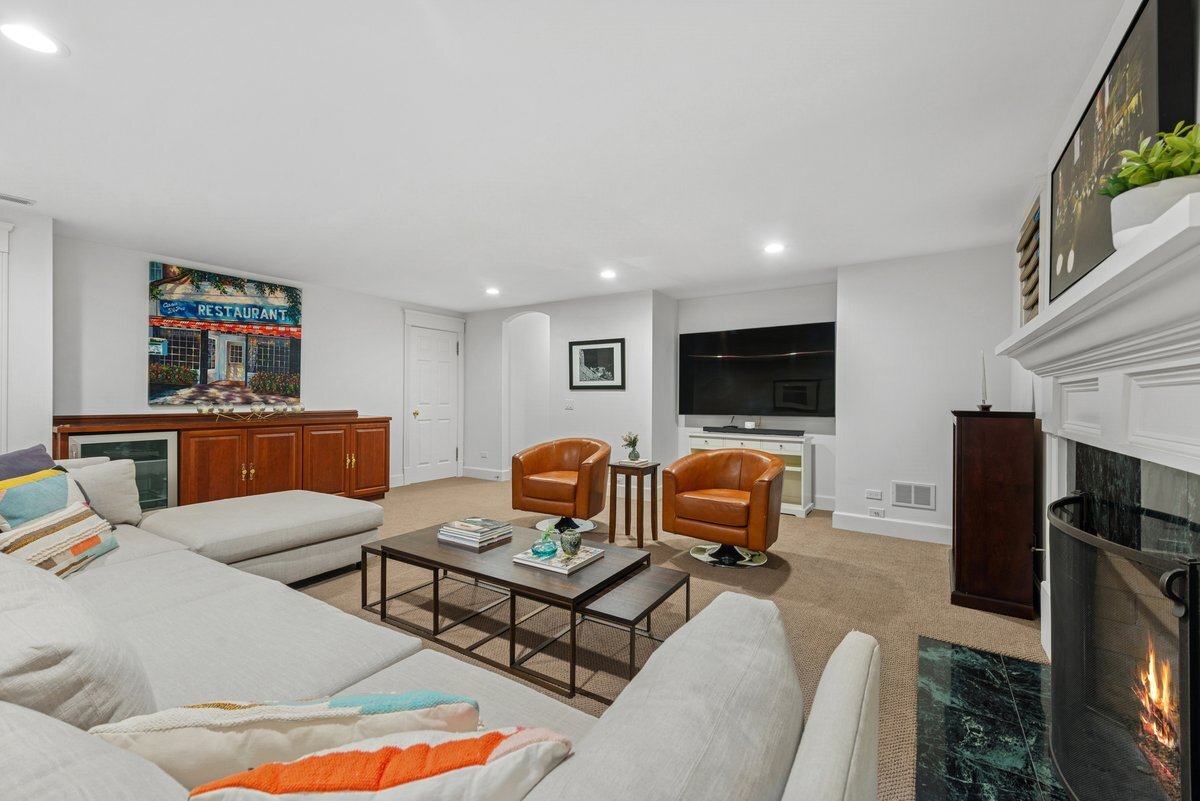 2661 North Dayton Street Chicago, IL 60614 - Photo 30 of 41 a living room with furniture a flat screen tv and a fireplace