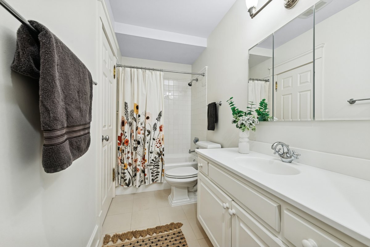 2661 North Dayton Street Chicago, IL 60614 - Photo 34 of 41 a bathroom with a sink a toilet and shower