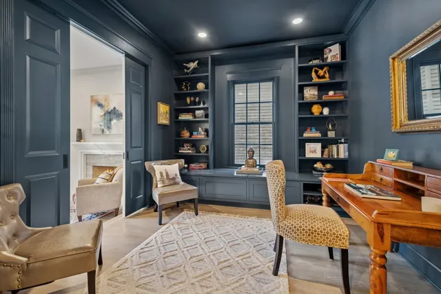 a work room with furniture and book shelf