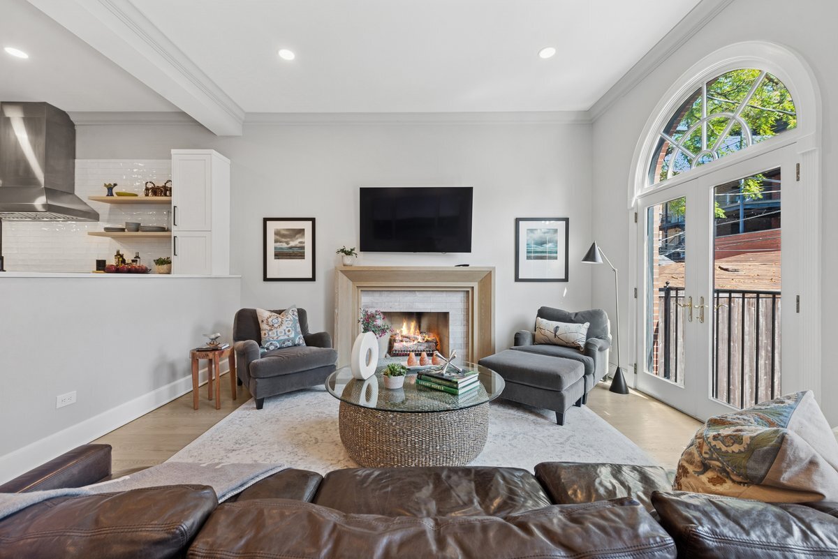 2661 North Dayton Street Chicago, IL 60614 - Photo 10 of 41 a living room with furniture a fireplace and a flat screen tv