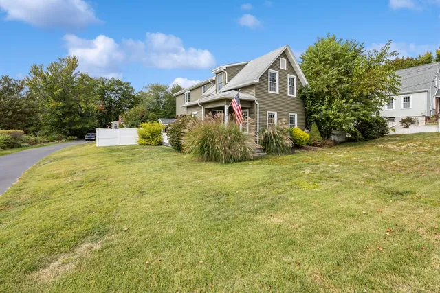 a front view of a house with a yard
