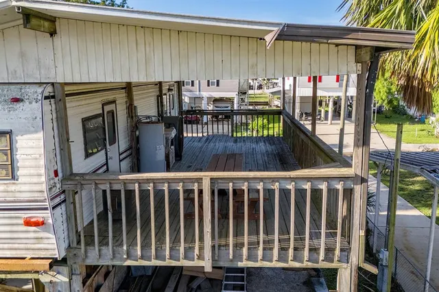 a view of a balcony with furniture