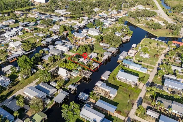 an aerial view of a houses with a street