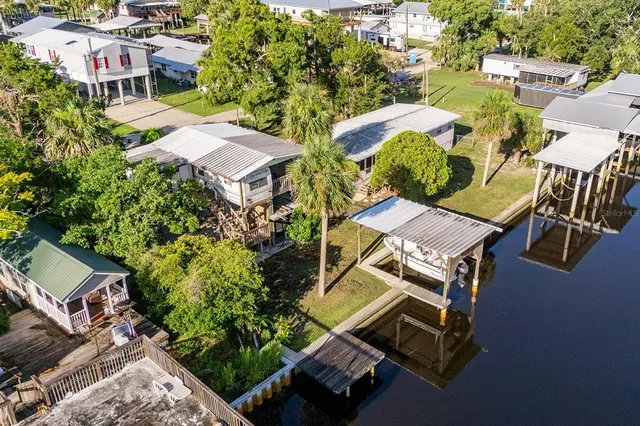 a aerial view of a house with a yard