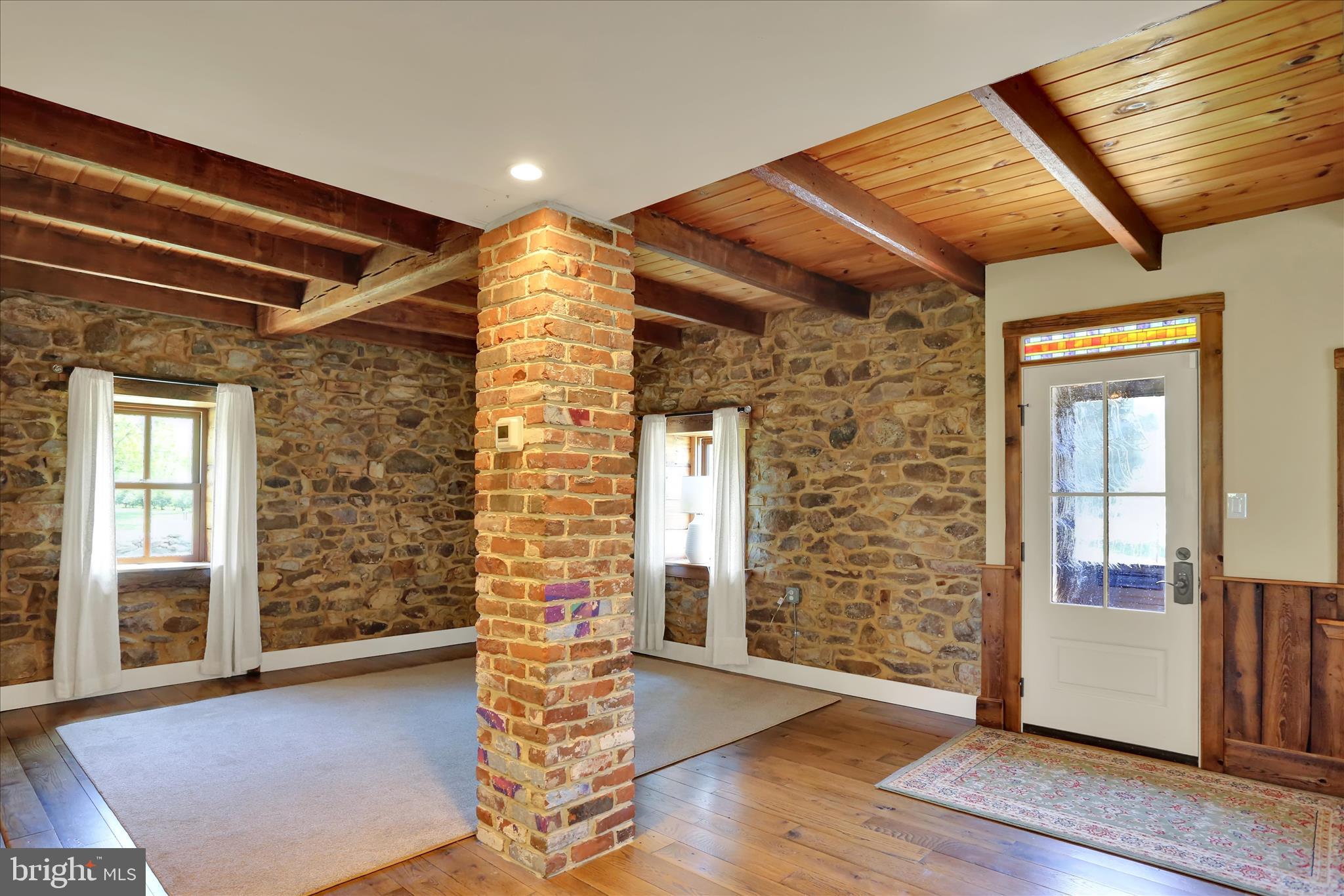 84 Cider Mill Road Mertztown, PA 19539 - Photo 6 of 50 Living Room with Stone Walls, Exposed Timbers....