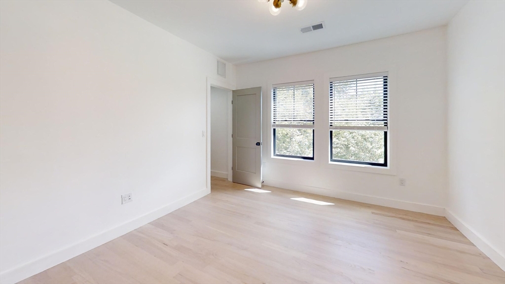 52 Withington Street, Unit 7 Boston, MA 02124 - Photo 14 of 19 an empty room with windows