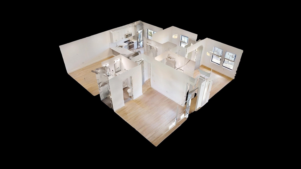 52 Withington Street, Unit 7 Boston, MA 02124 - Photo 15 of 19 a white bed sitting in a kitchen next to a white wall