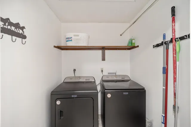a utility room with dryer and washer