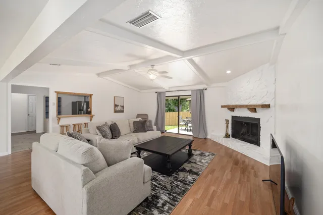 a living room with furniture and a fireplace
