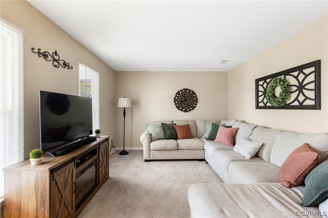 7217 Full Rack Drive Midlothian, VA 23112 - Photo 3 of 23 a living room with furniture and a flat screen tv