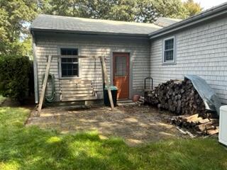 273 Huckins Neck Road Centerville, MA 02632 - Photo 14 of 18 a view of a house with a yard