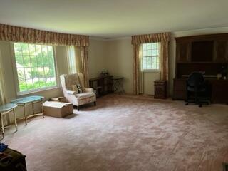 273 Huckins Neck Road Centerville, MA 02632 - Photo 6 of 18 a living room with furniture and a flat screen tv