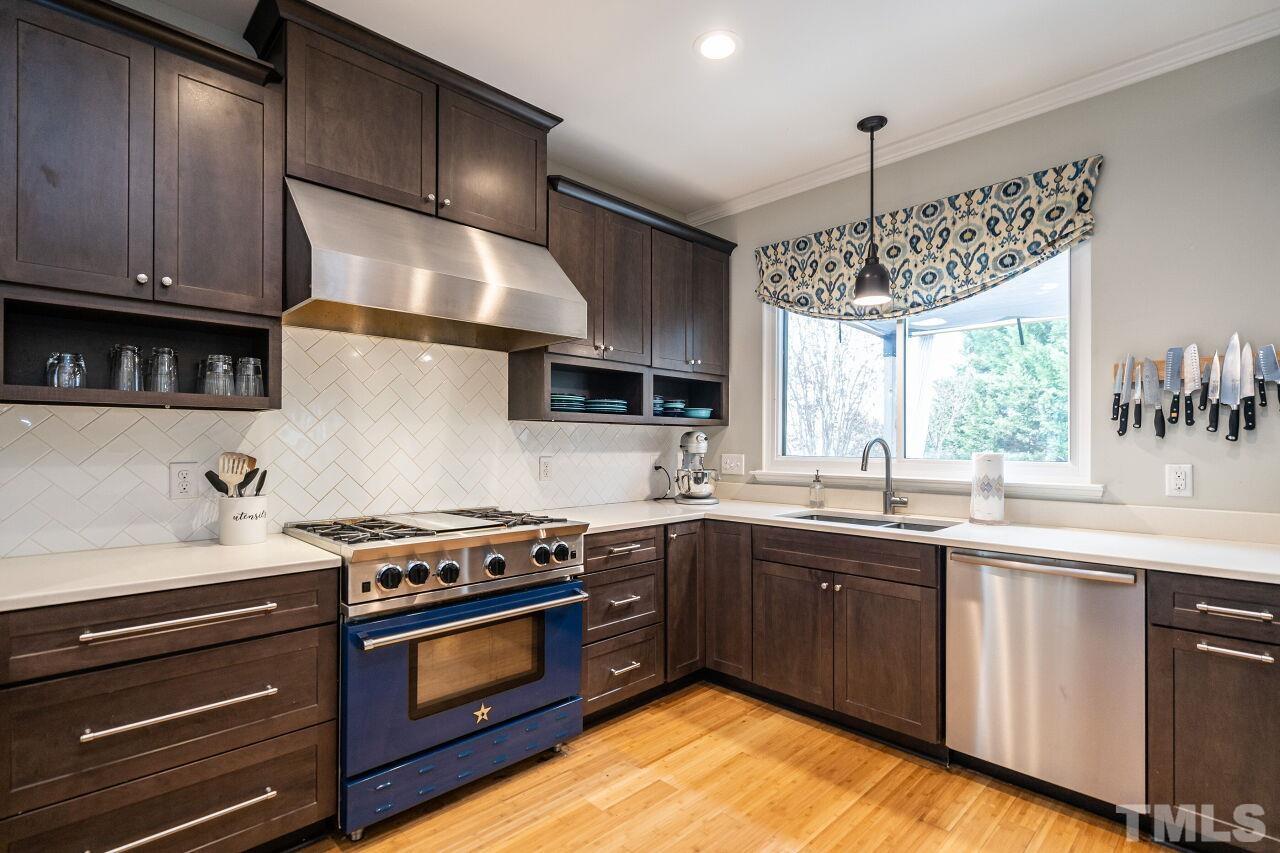 7443 Lagrange Drive Raleigh, NC 27613 - Photo 16 of 28 a kitchen with a stove and a sink