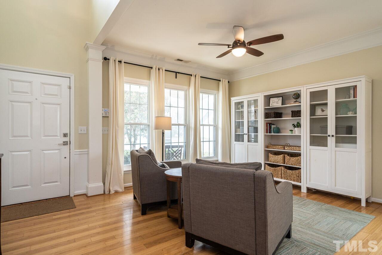 7443 Lagrange Drive Raleigh, NC 27613 - Photo 3 of 28 a living room with furniture and a floor to ceiling window