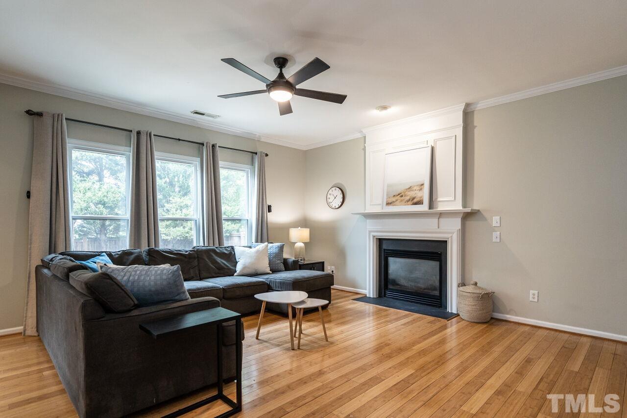 7443 Lagrange Drive Raleigh, NC 27613 - Photo 8 of 28 a living room with furniture and a fireplace