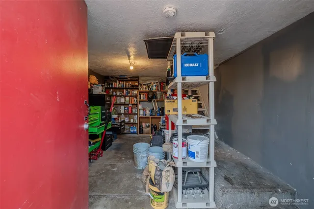 a reading room with furniture and book shelf