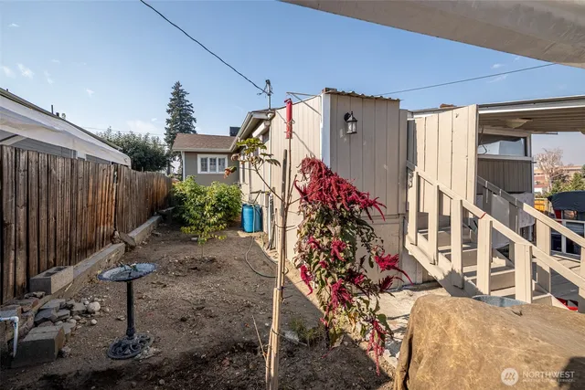 a view of a house with a flower garden