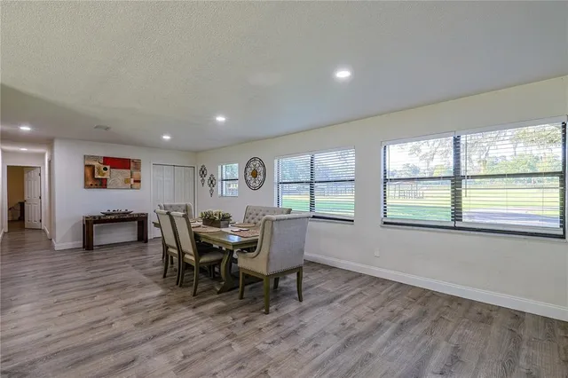 a dining room with furniture and window