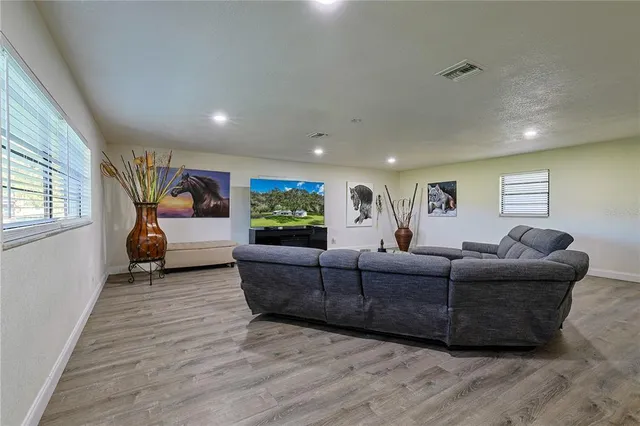 a living room with furniture and a window