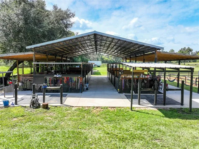 a view of a patio with a table chairs and a garden