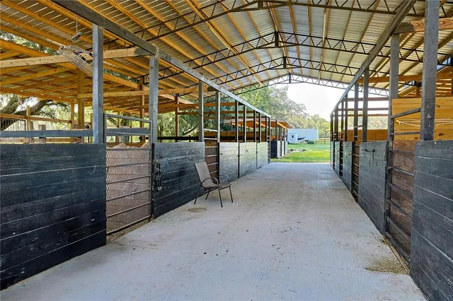 a view of a porch with a wooden fence