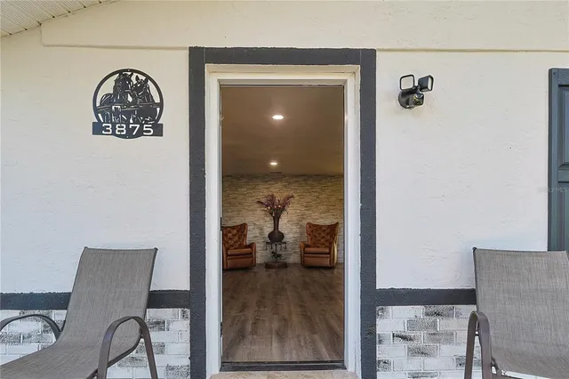 a view of a livingroom with furniture and front door