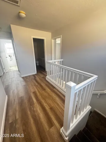 a view of entryway with wooden floor
