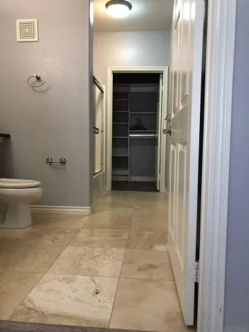 a view of a closet area with living room